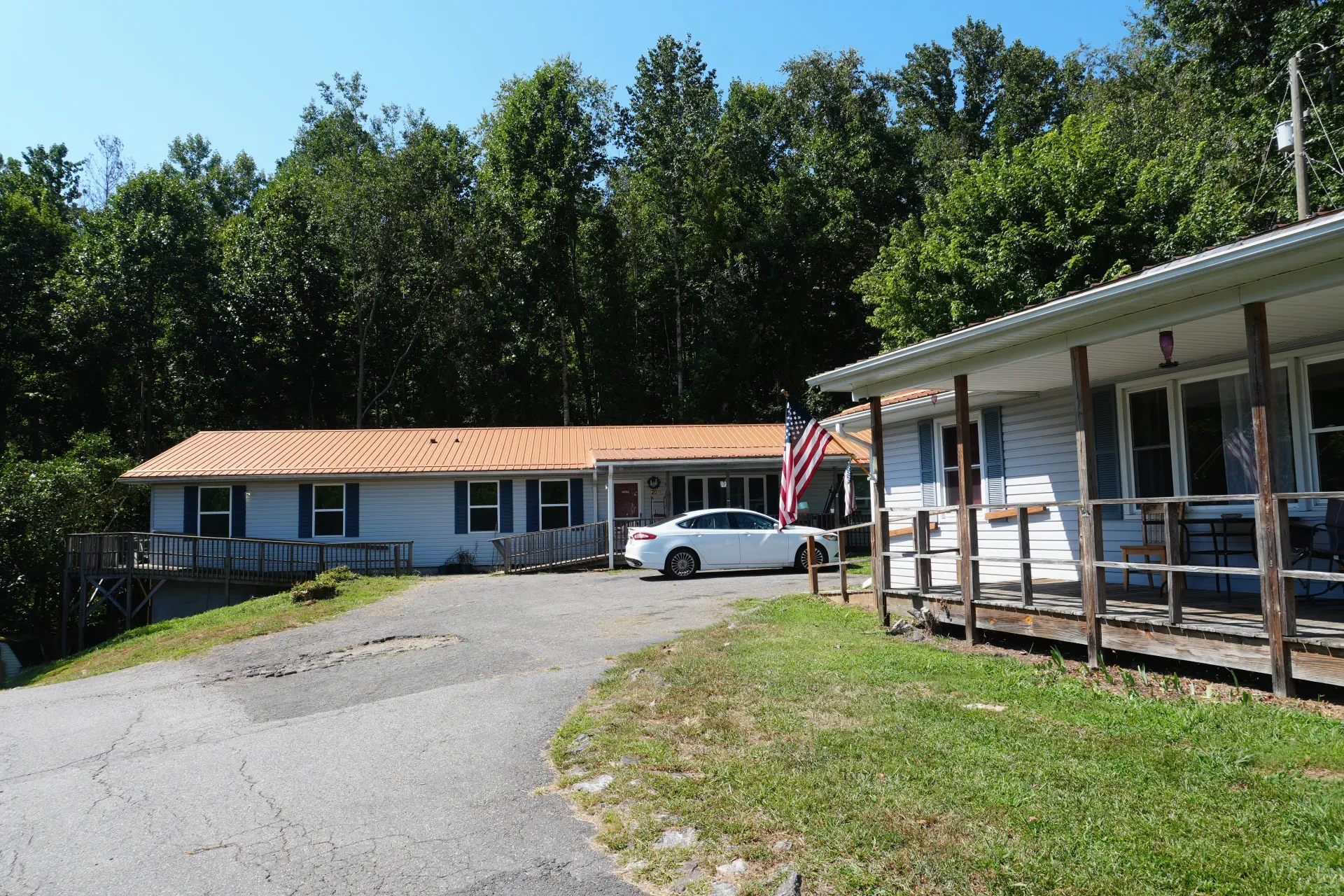 The approach to one of the homes, the drive curving up to the porch.
